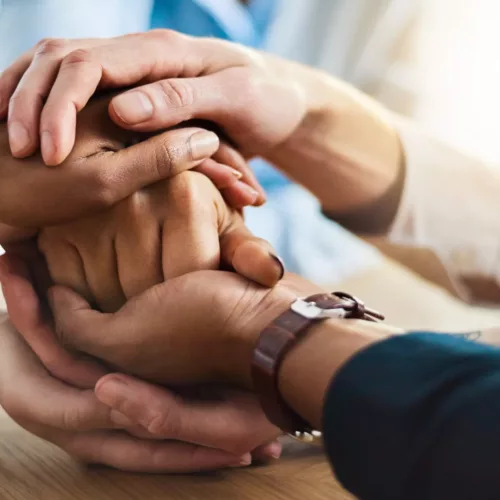 Hands holding each other